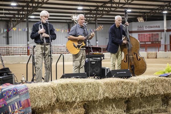 Three on a String performing for the audience